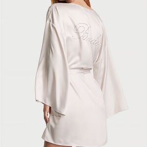 Brand new with tags, short satin “bride” embossed Victoria’s Secret robe.